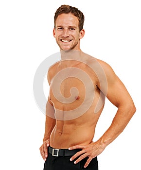 Fit and healthy. Studio portrait of a handsome young man posing shirtless against a white background.