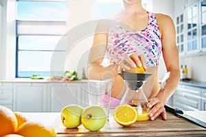Fit healthy woman making fresh juice