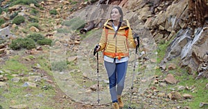 Fit healthy young woman hiking on a trail
