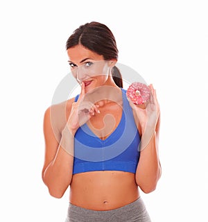 Fit lady secretly eating sugary food