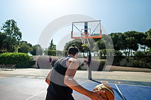 Fit male playing basketball outdoor