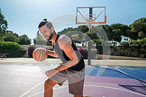 Fit male playing basketball outdoor