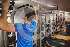 Fit man doing pull ups