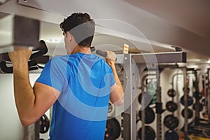 Fit man doing pull ups