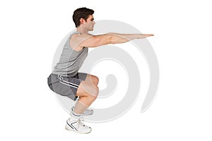 Fit man doing squats