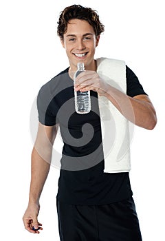 Fit man drinking water isolated on white