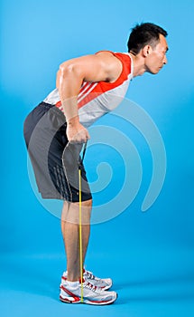 Fit man with exercise stretch band