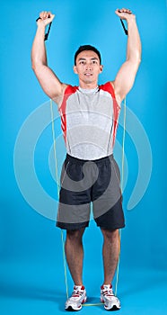 Fit man with exercise stretch band