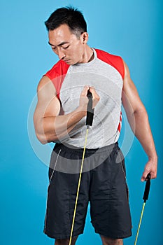 Fit man with exercise stretch band