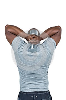 Fit man exercising with dumbbell