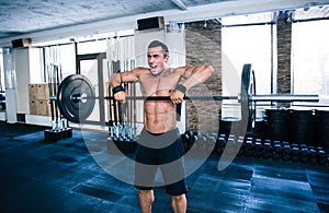 Fit man lifting barbell