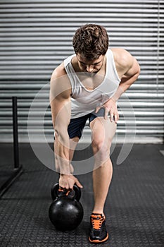 Fit man lifting dumbbells