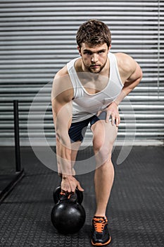 Fit man lifting dumbbells