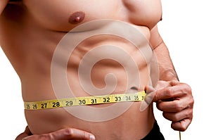 Fit Man Measuring His Waist photo