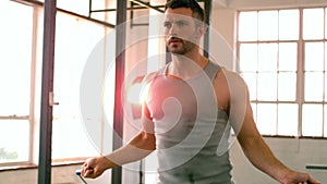 Fit man using skipping rope