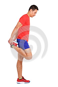 Fit mature asian man stretching his legs muscles