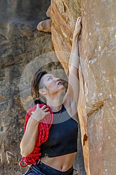 A Fit Mixed Race Female Athlete Rock Climbs In The Pacific Northwest