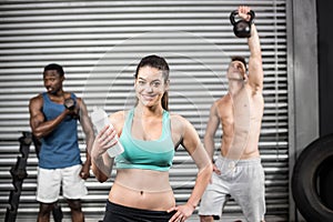 Fit people lifting dumbbells