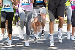 Fit people running race in park