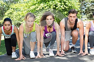 Fit people running race in park