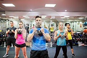 Fit people working out in fitness class