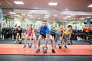 Fit people working out in fitness class