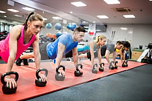 Fit people working out in fitness class