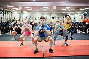 Fit people working out in fitness class