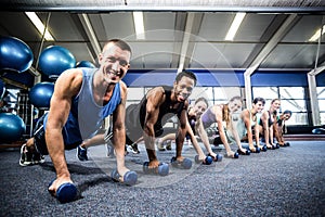 Fit people working out in fitness class