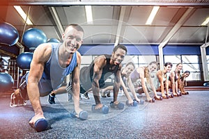 Fit people working out in fitness class