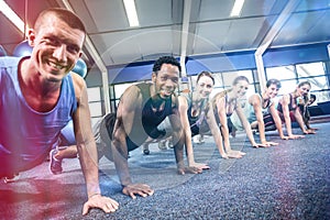 Fit people working out in fitness class