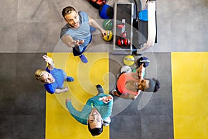 Fit people working out in fitness class at the gym