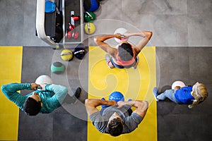 Fit people working out in fitness class at the gym