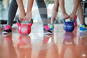 Fit people working out in fitness class at the gym