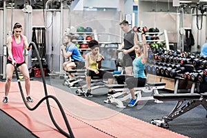 Fit people working out in weights room