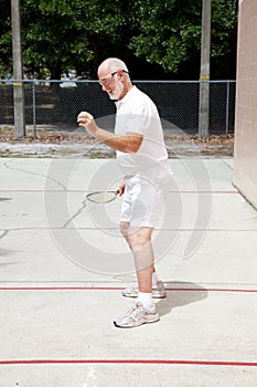Fit Senior Man Playing Racquetball photo