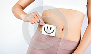 Fit Slim Body Holding White Card With Happy .Smiley Face In Hands Good Digestion Concepts