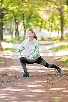 Fit sportive women stretching in the park