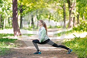 Fit sportive women stretching in the park