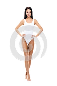 Fit and sporty girl in white swimsuit. Sport, fitness, diet, weight loss and healthcare concept.