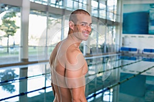 Fit swimmer by the pool at leisure center