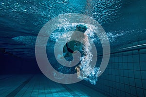 Fit swimmer training by himself