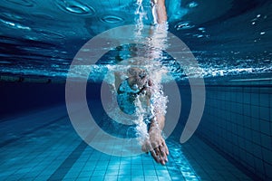 Fit swimmer training by himself