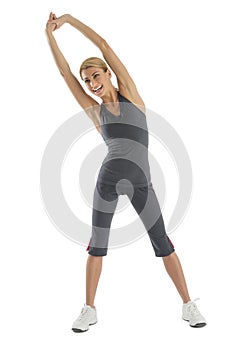 Fit Woman With Arms Raised Doing Stretching Exercise