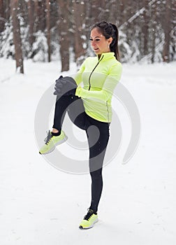 Fit woman athlete doing stretches female runner