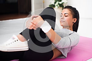 Fit woman doing aerobics gymnastics stretching