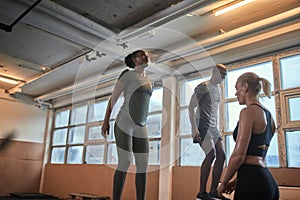 Fit woman doing box jumps during a gym exercise session