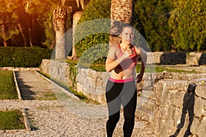 Fit Woman Doing Cardio Exercises In The Park