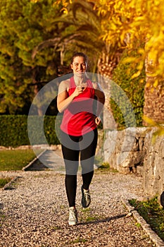 Fit Woman Doing Cardio Exercises In The Park