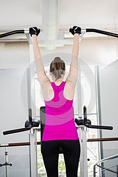 Fit woman doing pull up